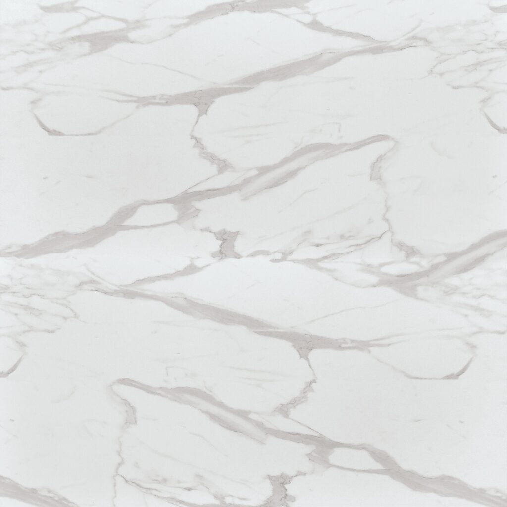 Tavolo allungabile e girevole in ceramica bianca effetto marmo con gambe a compasso in sala